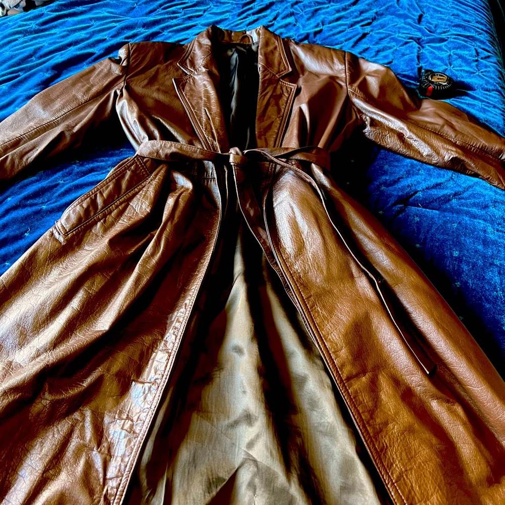 Vintage soft brown leather trench coat with pockets and belt.